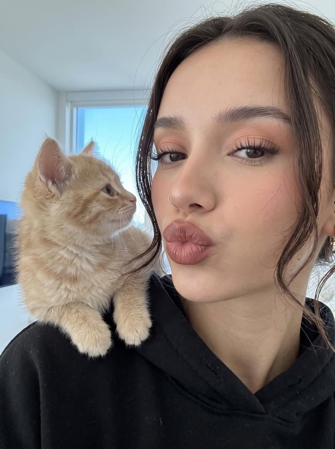 Ultra-realistic close-up selfie of a beautiful young woman w
