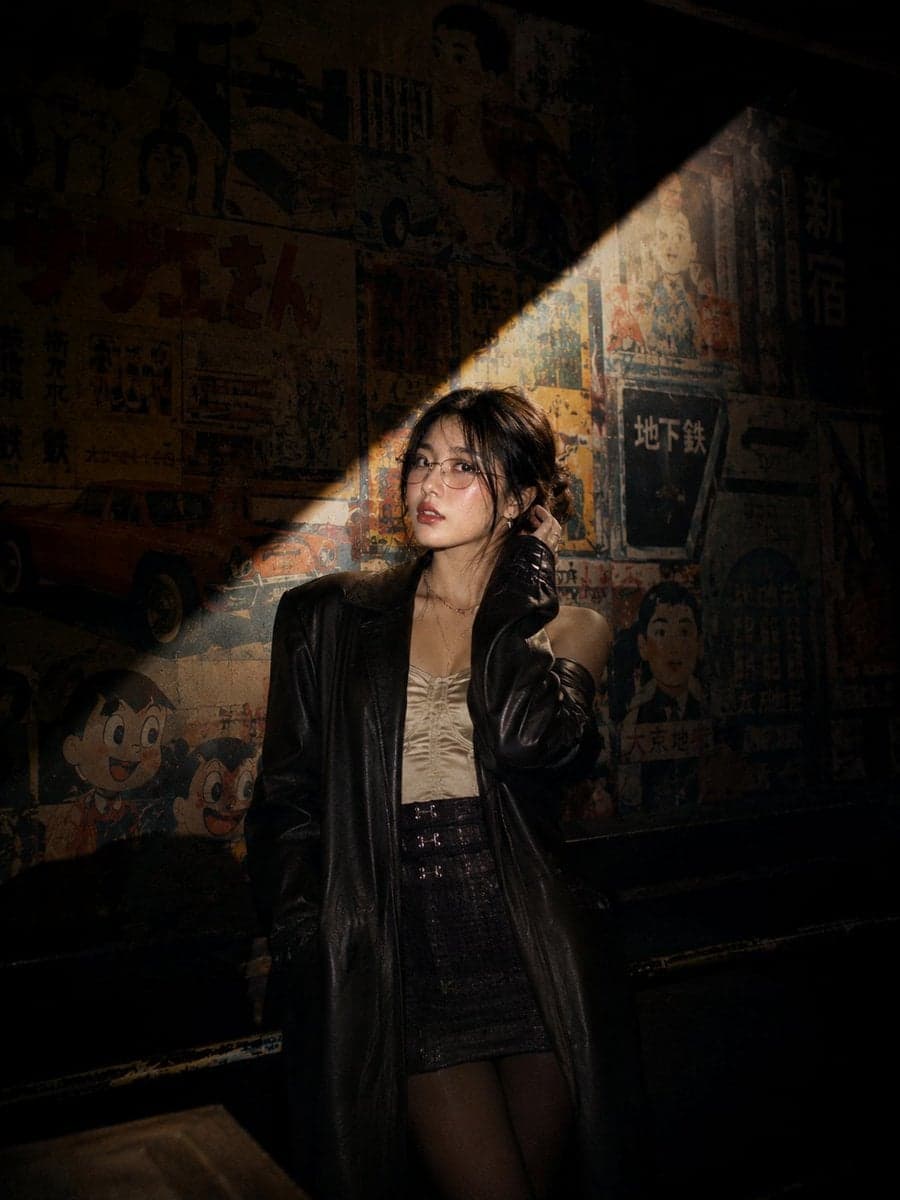 Cinematic nighttime portrait of a stylish young Asian woman 
