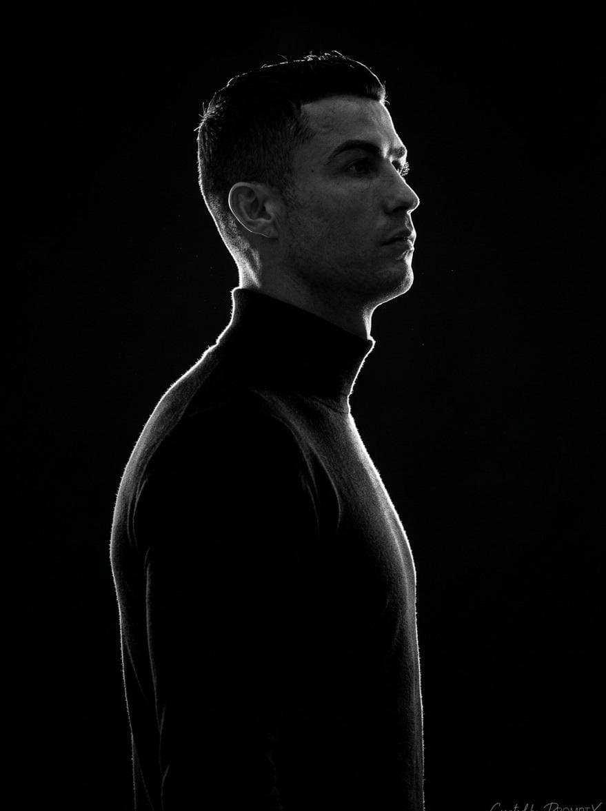A stark, high-contrast, black-and-white (monochromatic) side