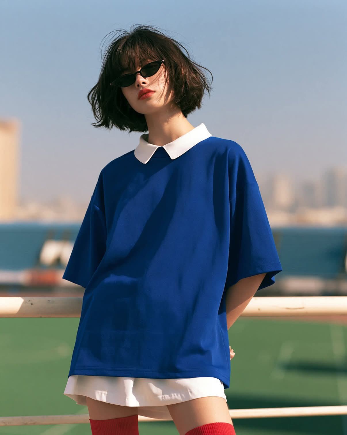 Moody sports fashion editorial portrait, stylish young woman