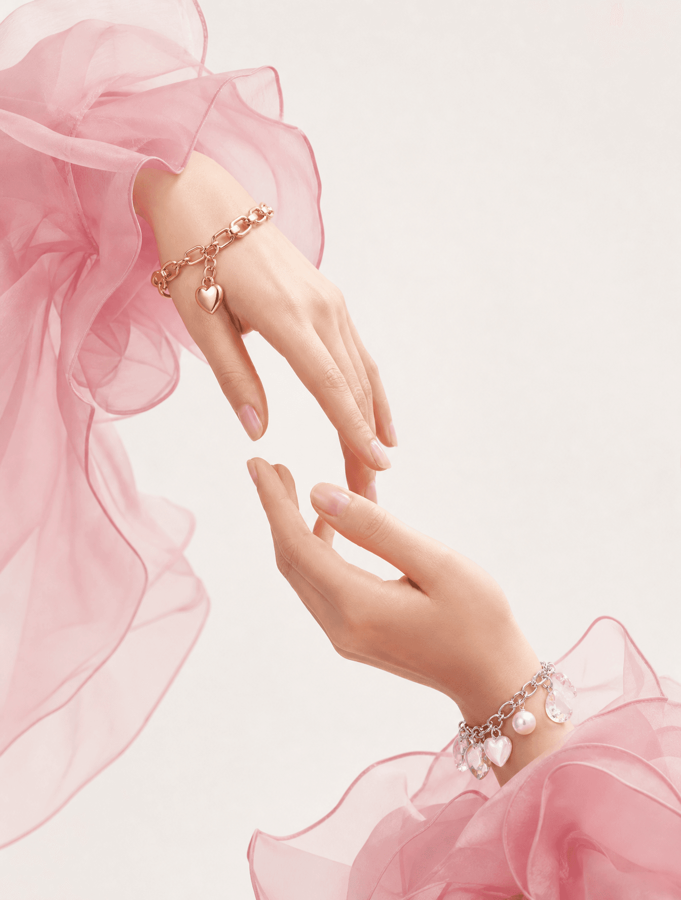 Two delicate hands reach toward each other in a graceful, sy