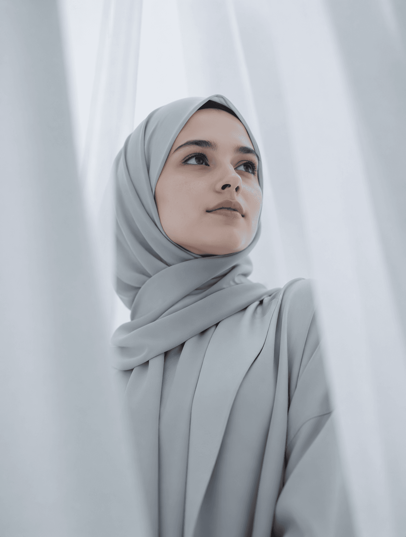 A low-angle, medium close-up portrait of the exact person fr