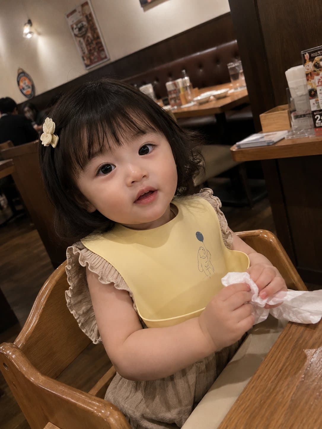 Photorealistic candid smartphone snapshot of an adorable tod