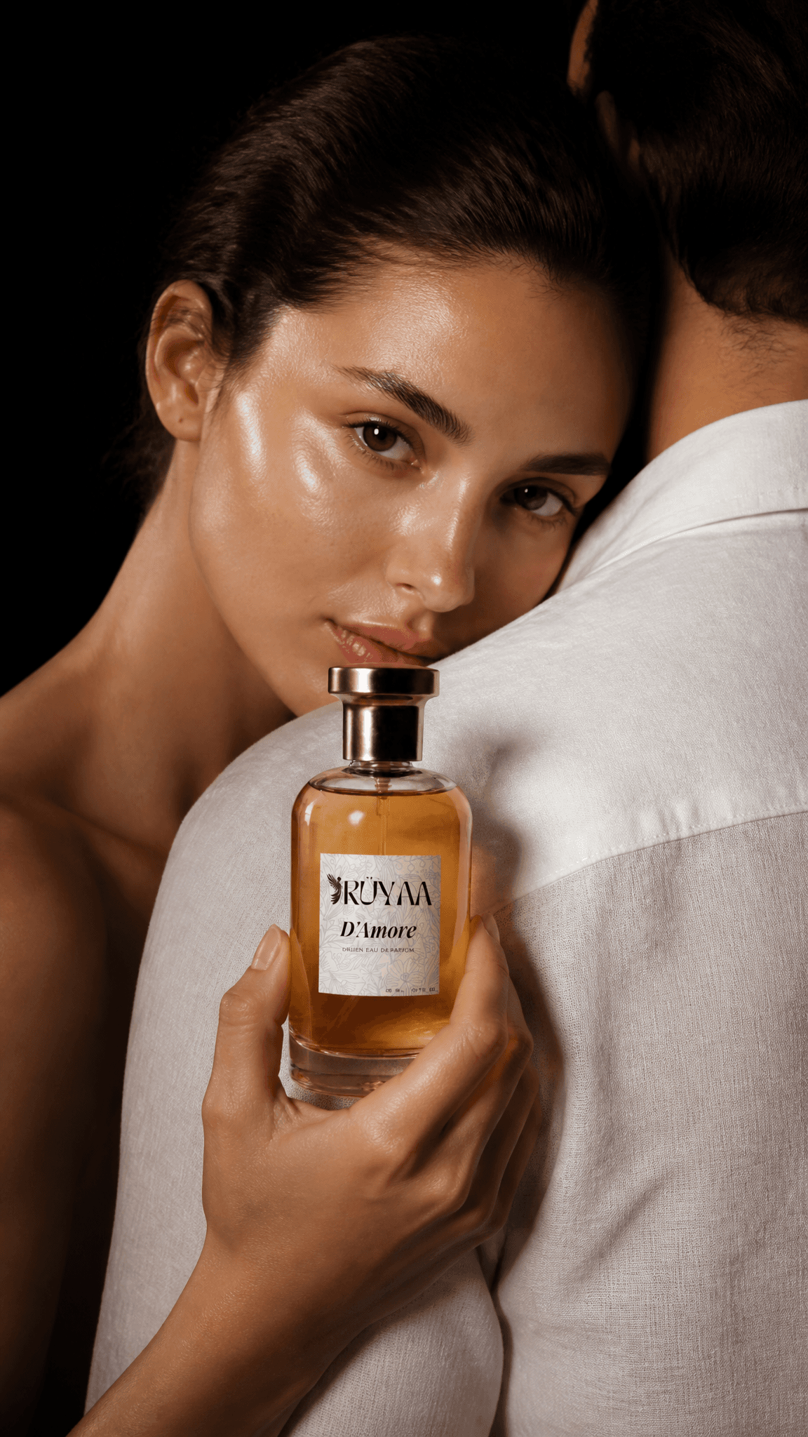 A high-end editorial perfume advertisement features a woman