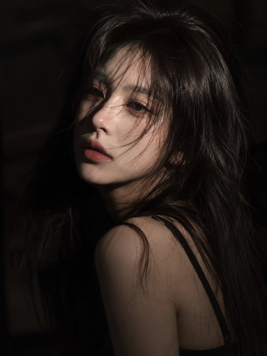 A cinematic close-up portrait of a young East Asian woman wi