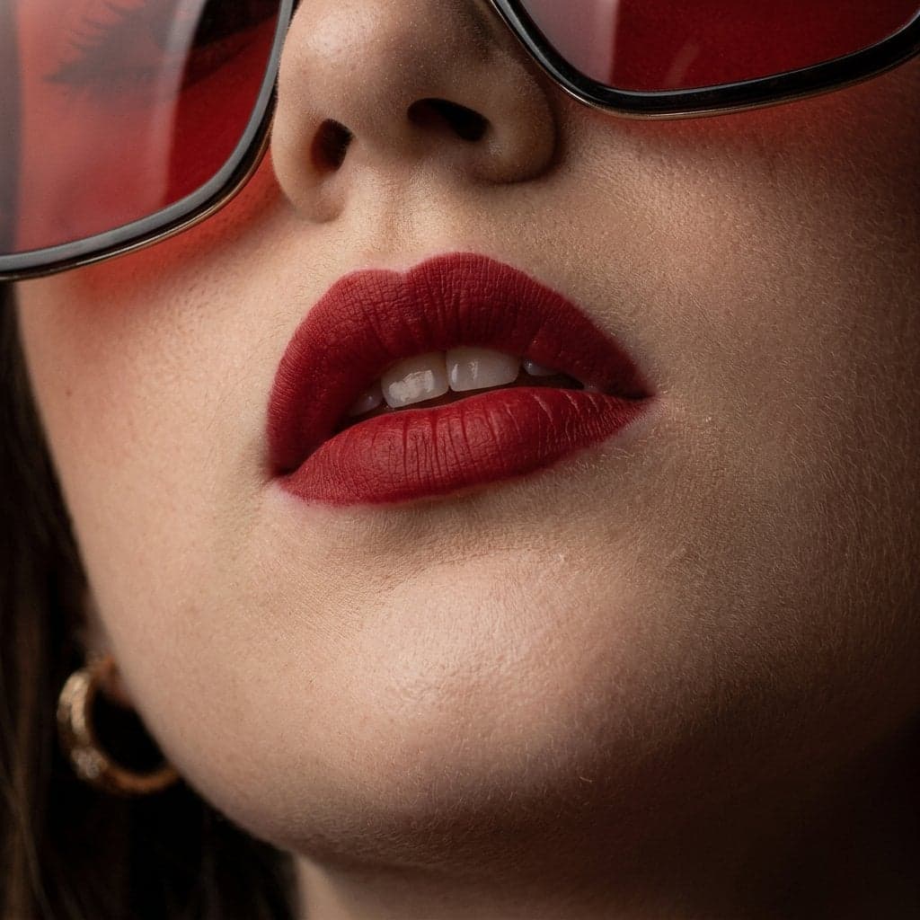 High-fashion beauty portrait of young woman with sleek cente