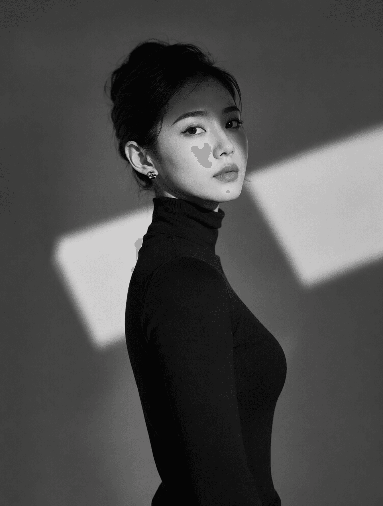 A high-resolution black and white portrait of a woman wearin