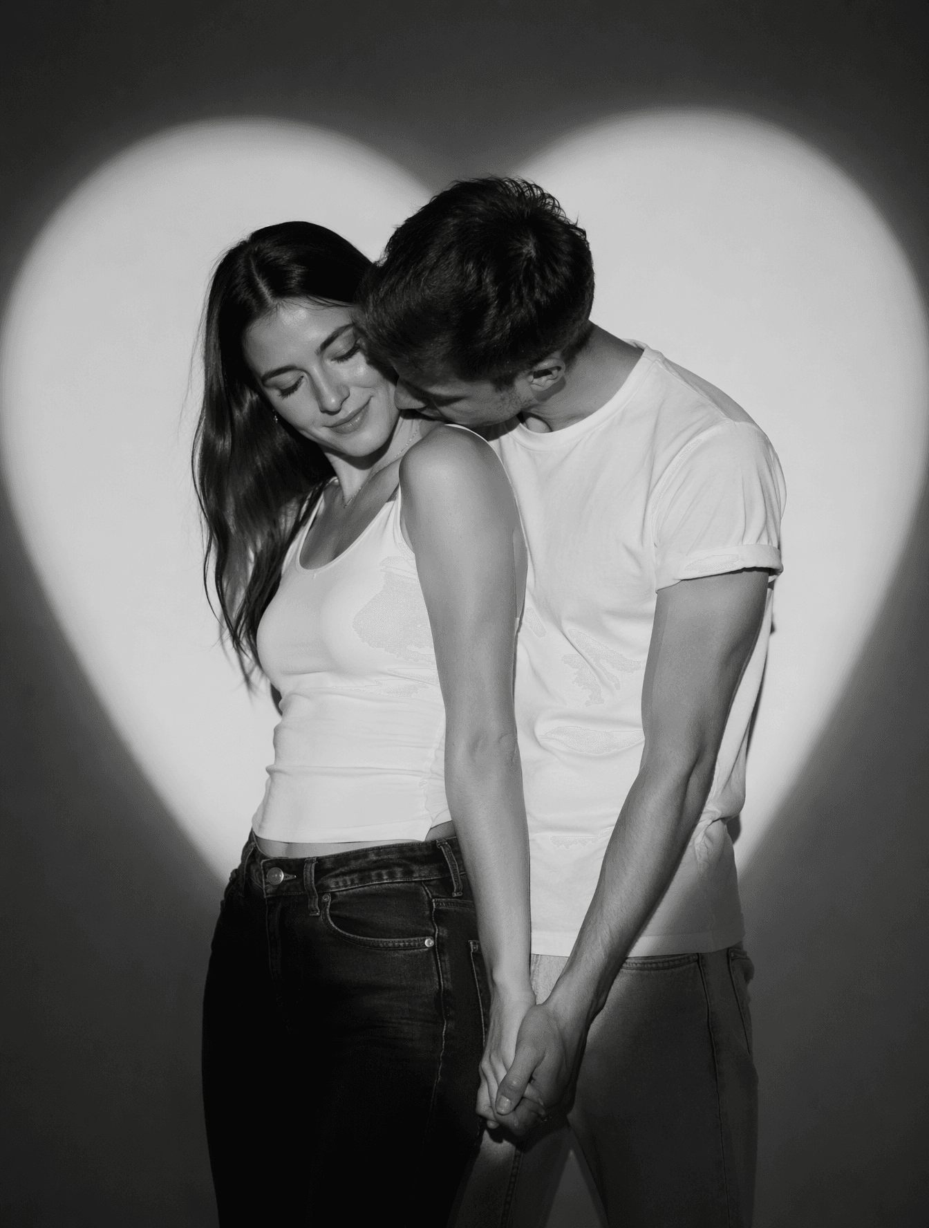 Create a romantic black-and-white studio portrait of a real