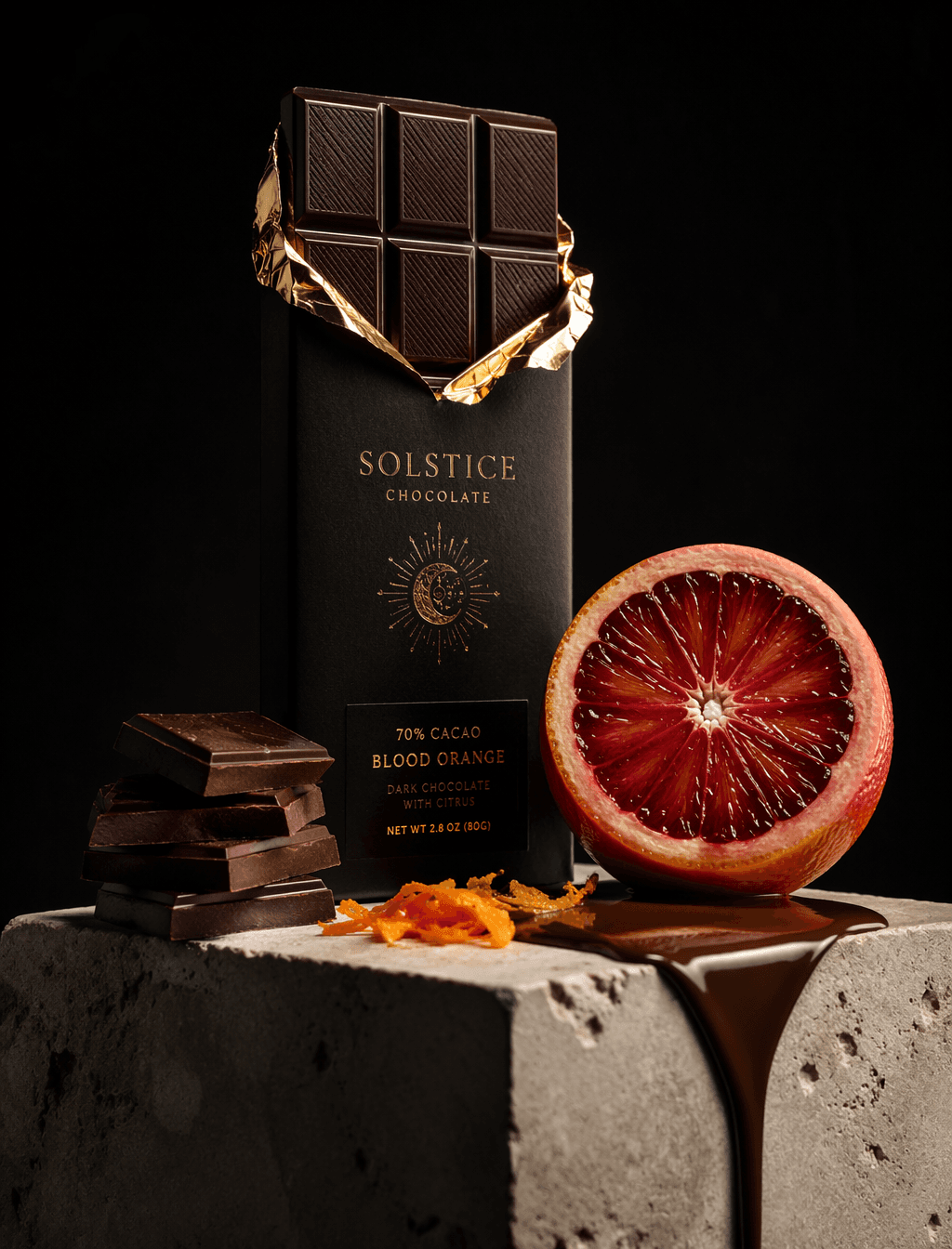 A premium dark chocolate bar wrapped in matte black paper wi