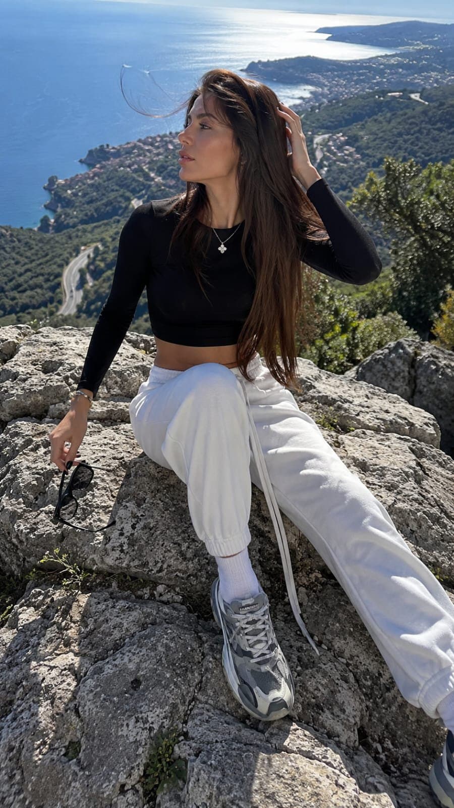A candid luxury travel-fashion photograph with a natural, un