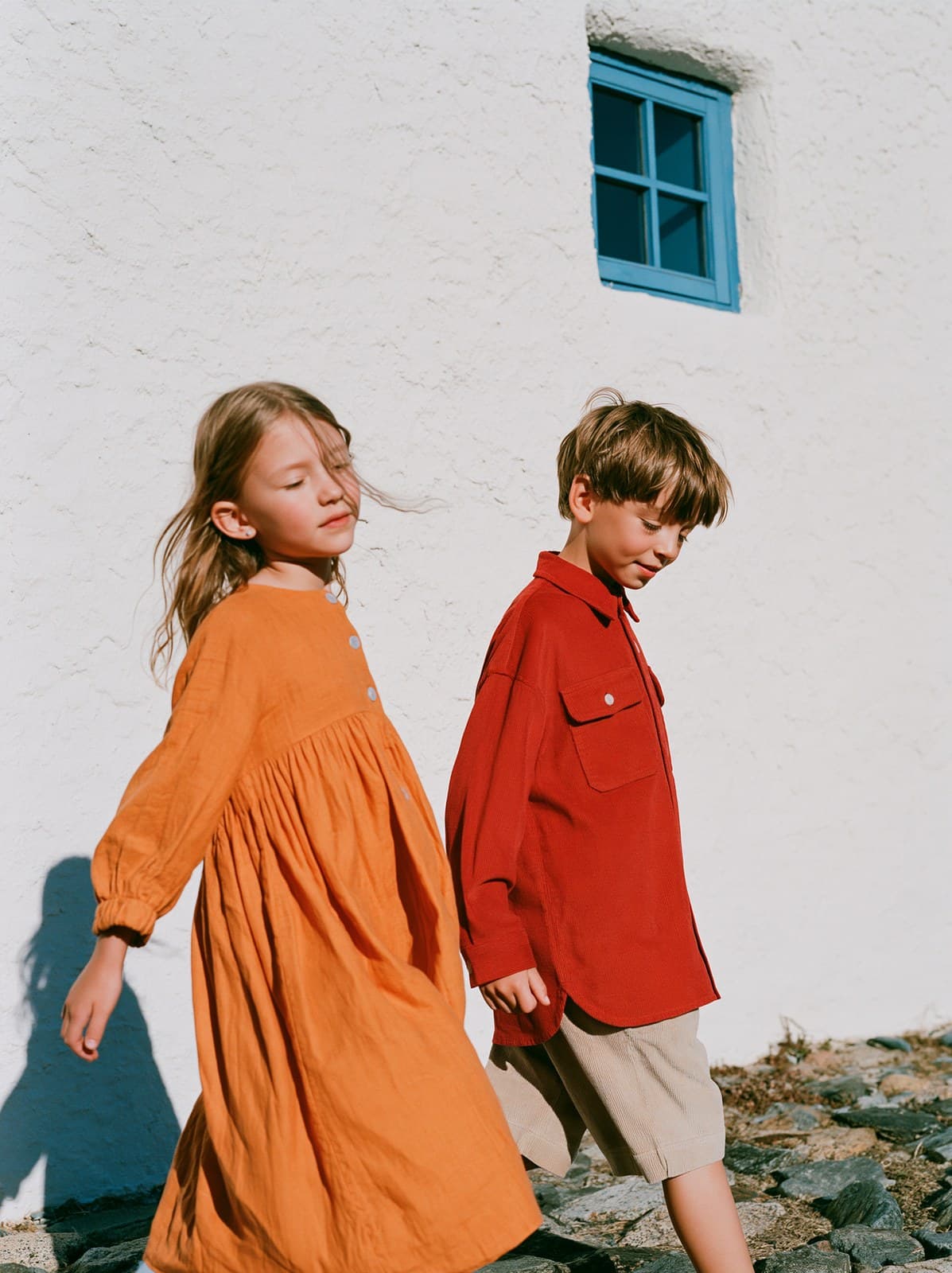 High-fashion children's commercial full-body shot, three-qua