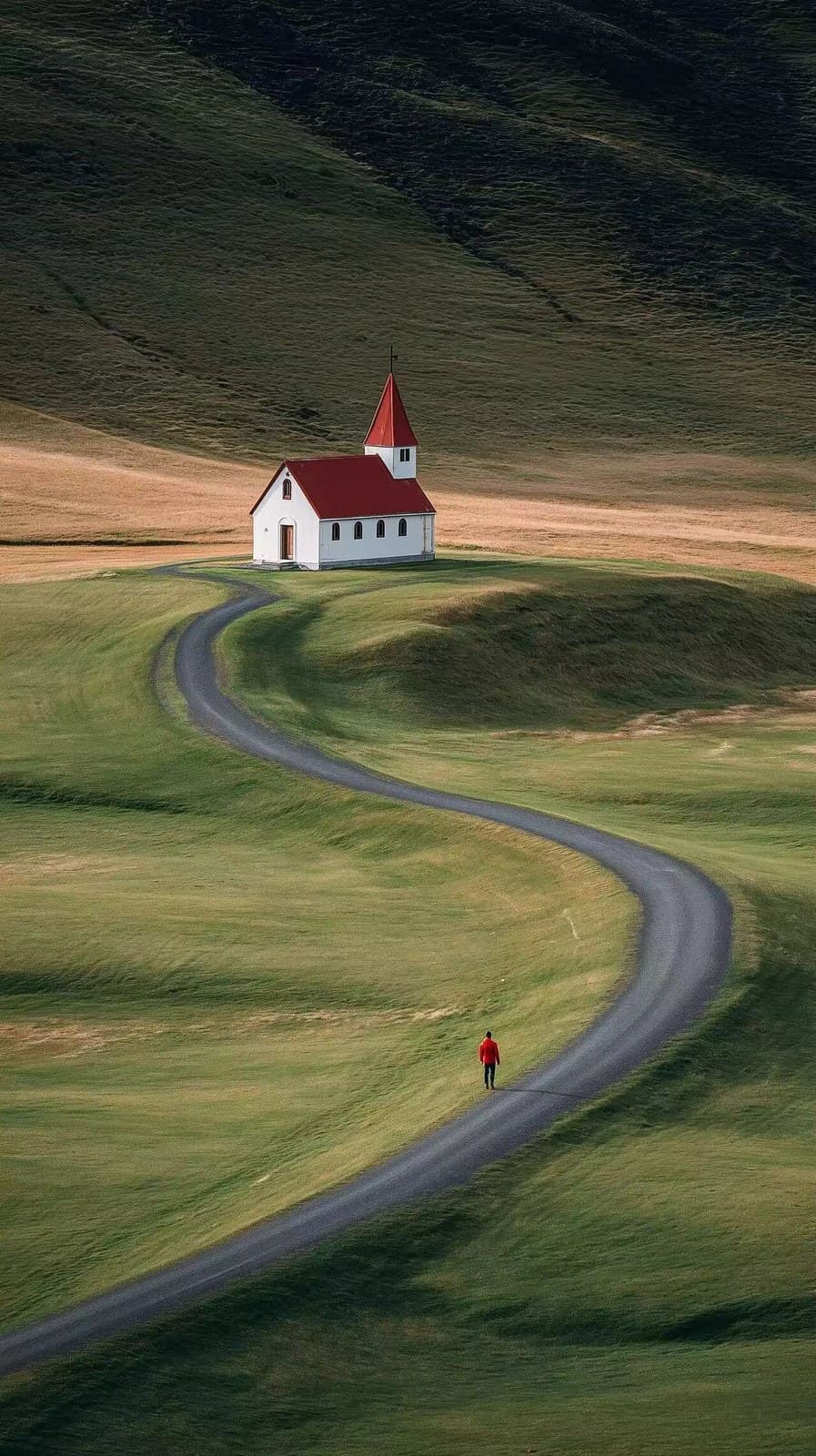 iceland, a small church on the top of a hill with a red roof