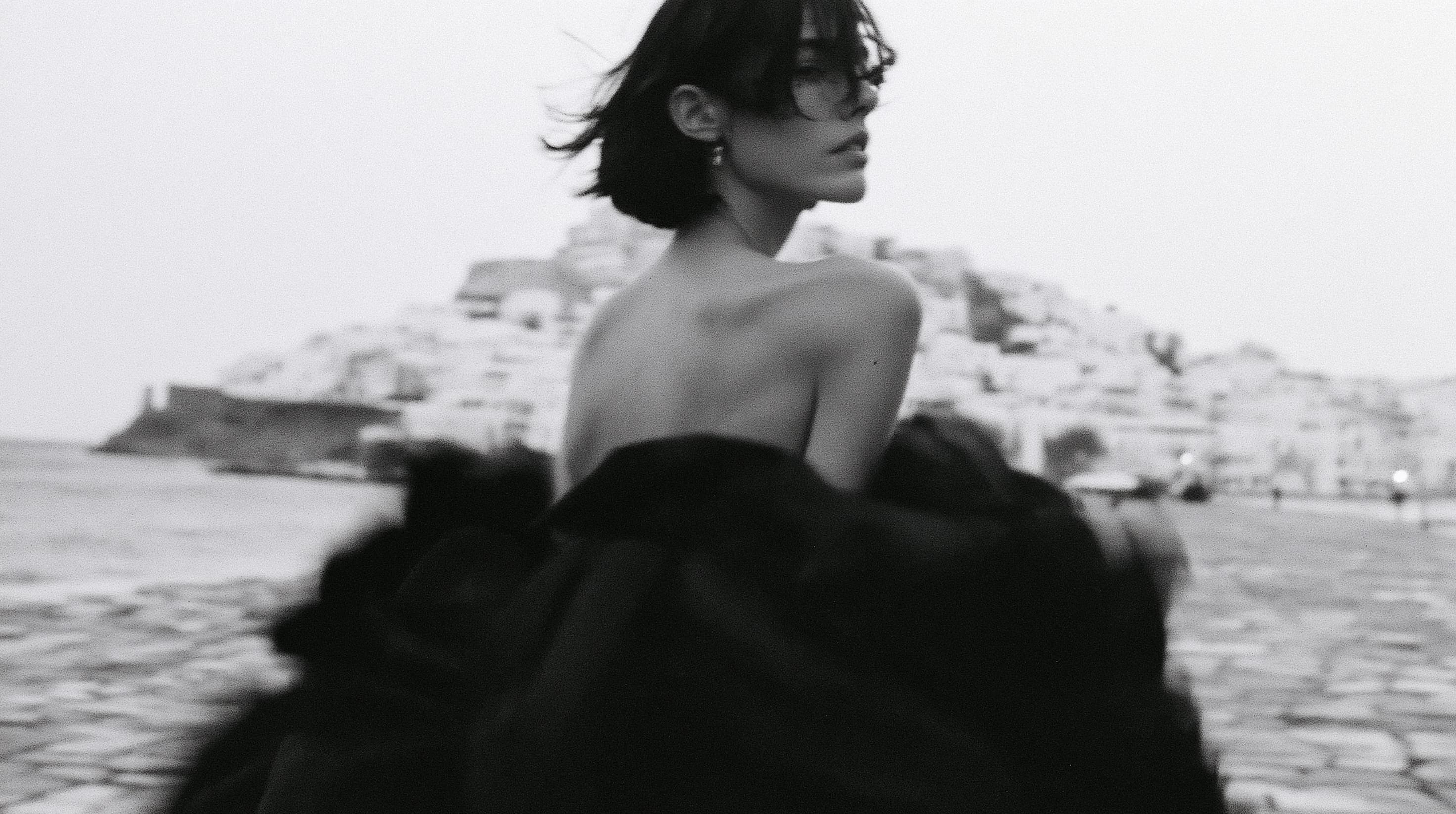 High-fashion black and white photo. A young woman with a sho