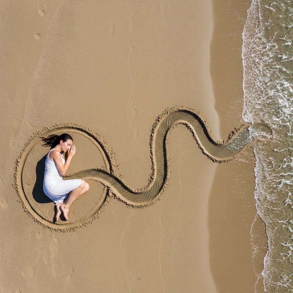 {
"intent": {
"summary": "Land-art photography of a wo