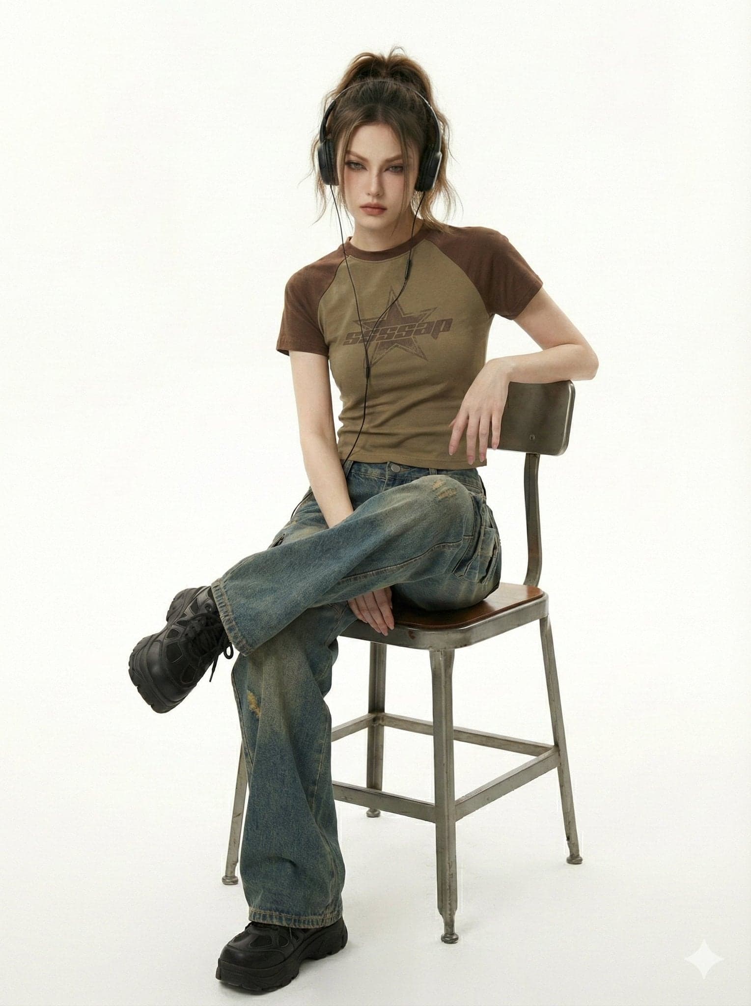 She kneels in a pristine white studio, shot from a low mid a