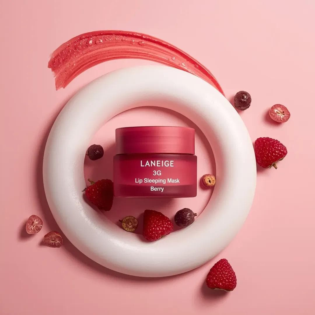 A centrally placed pink cosmetic jar labeled “LANEIGE Lip Sl
