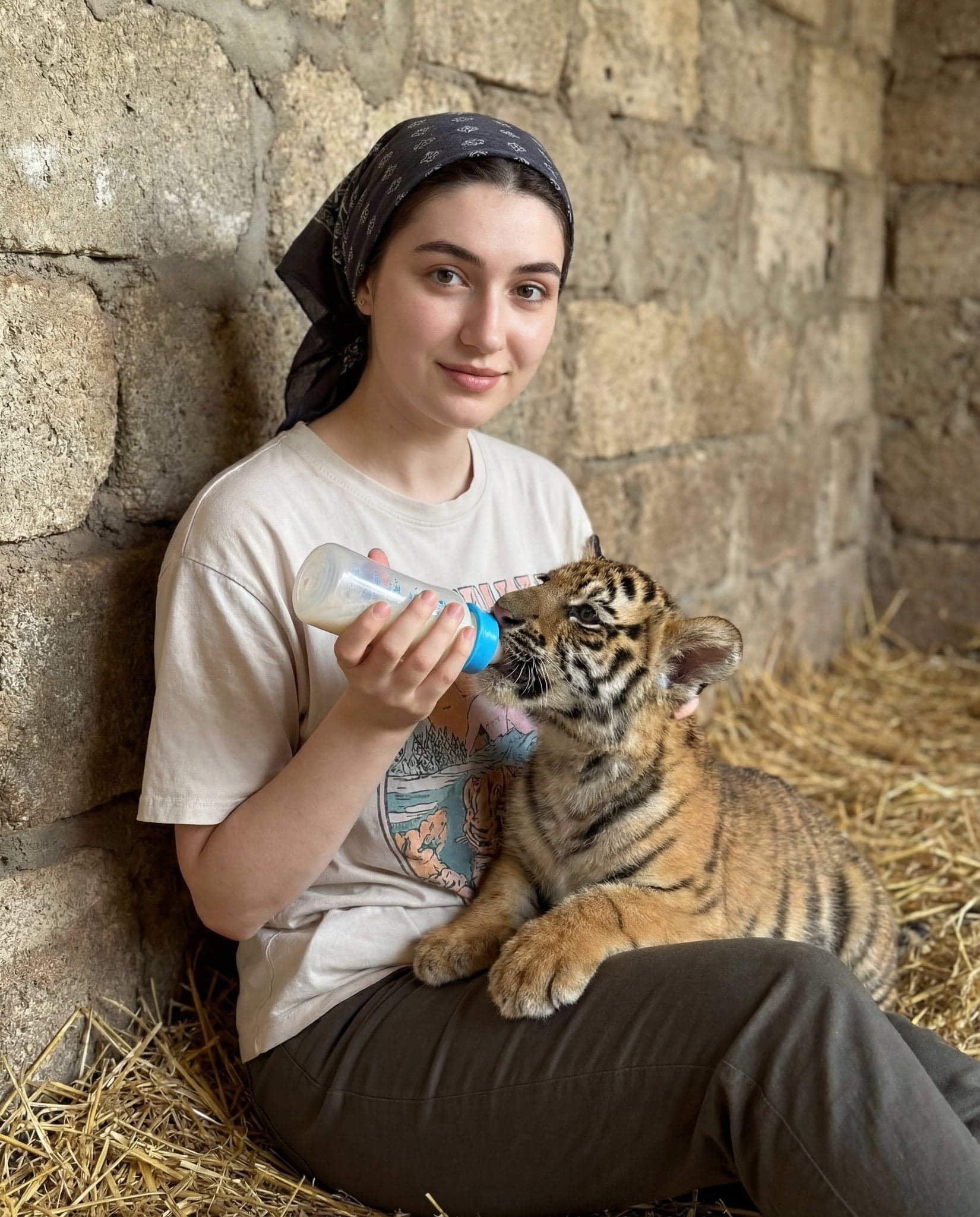 { "scene_type": "lifestyle portrait with animal interaction"