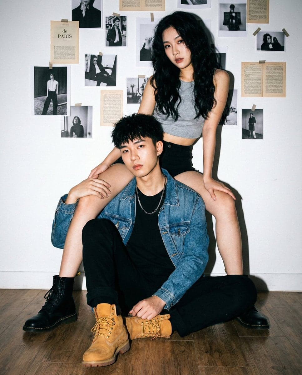 "Young Asian couple, cool/edgy fashion models.",
"fema