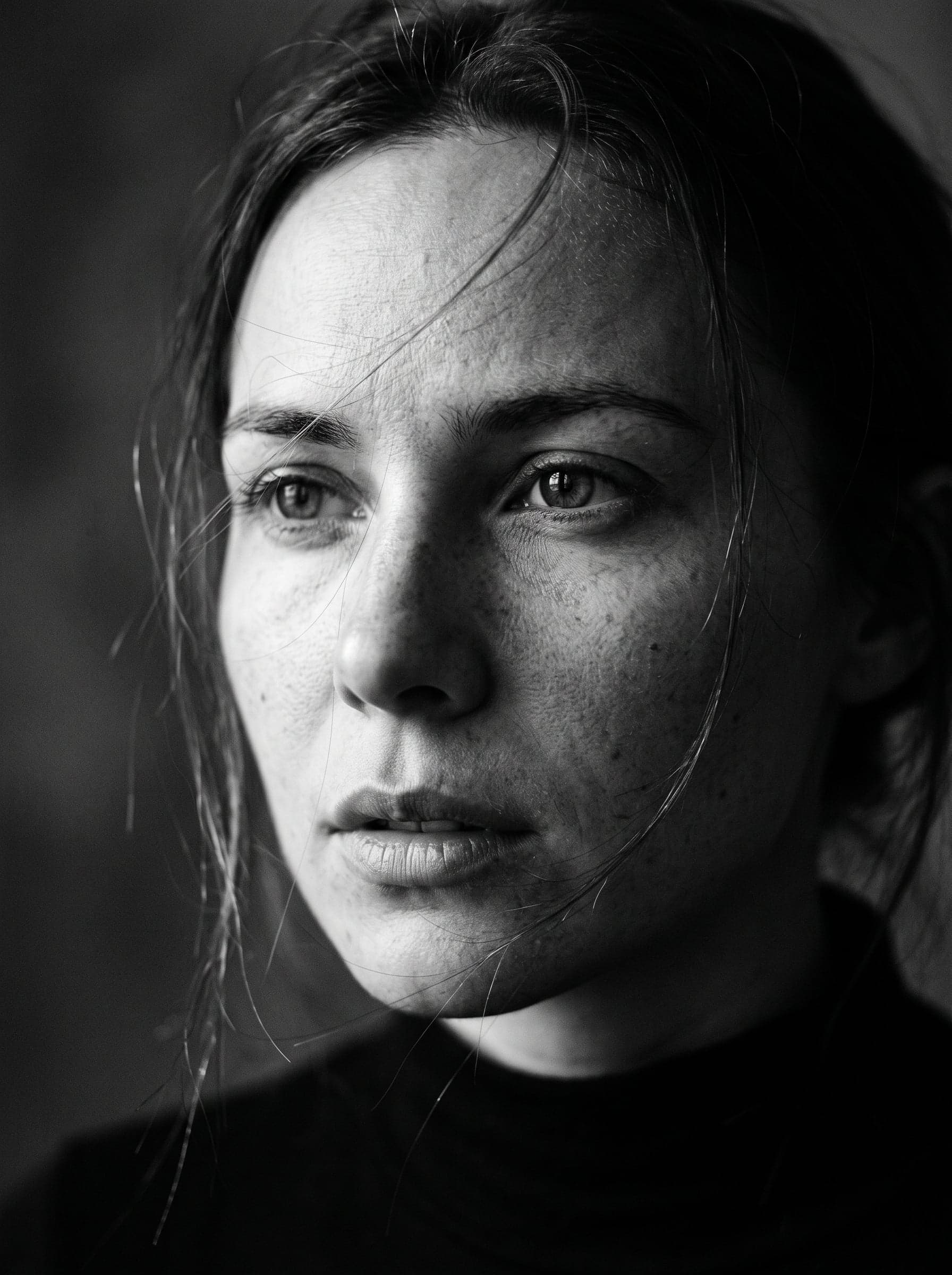 Ultra-detailed black and white cinematic close-up portrait o