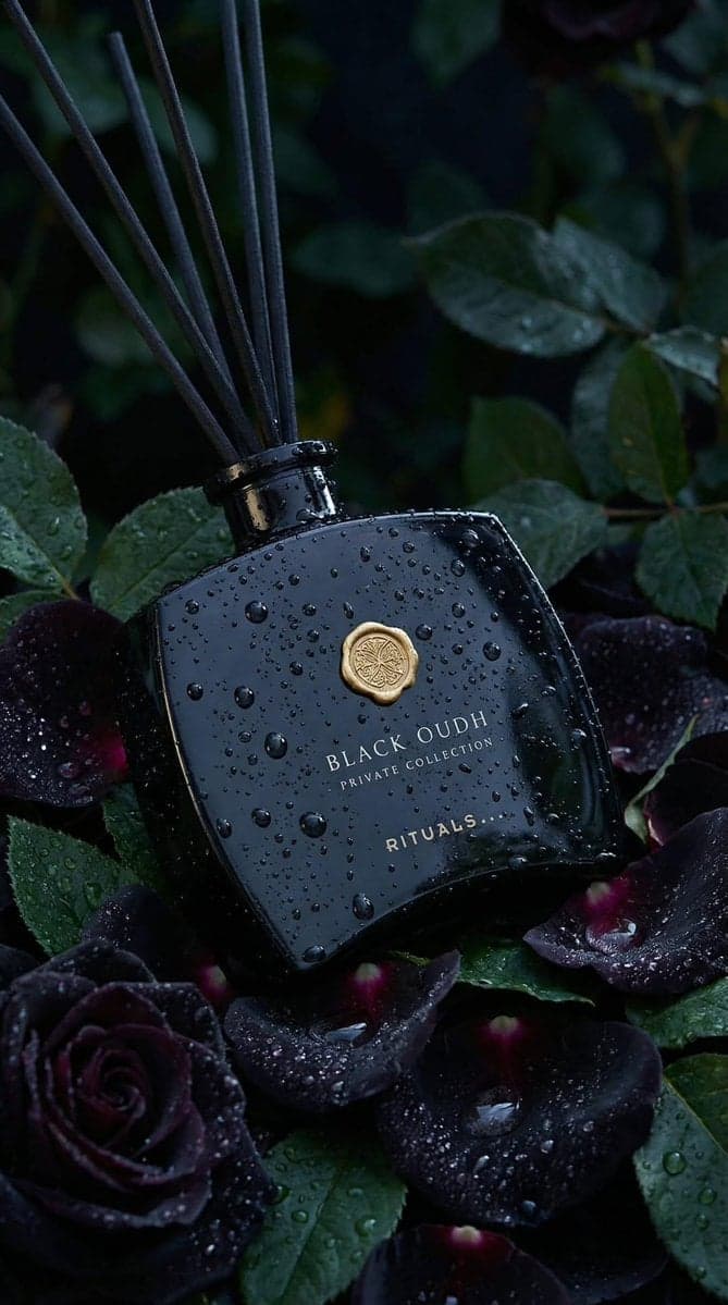 Ultra-realistic luxury product photography of a black glass 