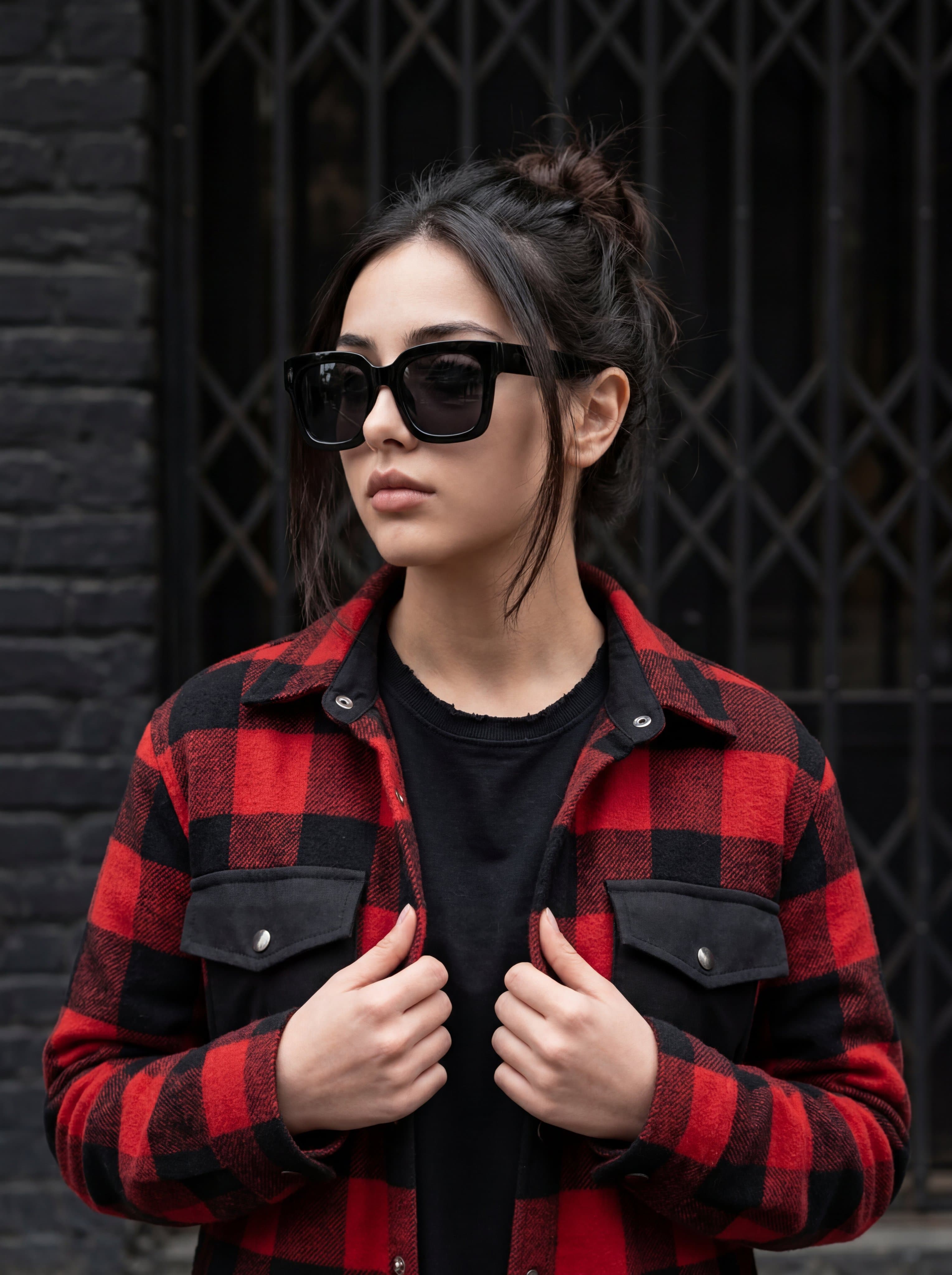 A medium shot portrait of a stylish young woman looking off