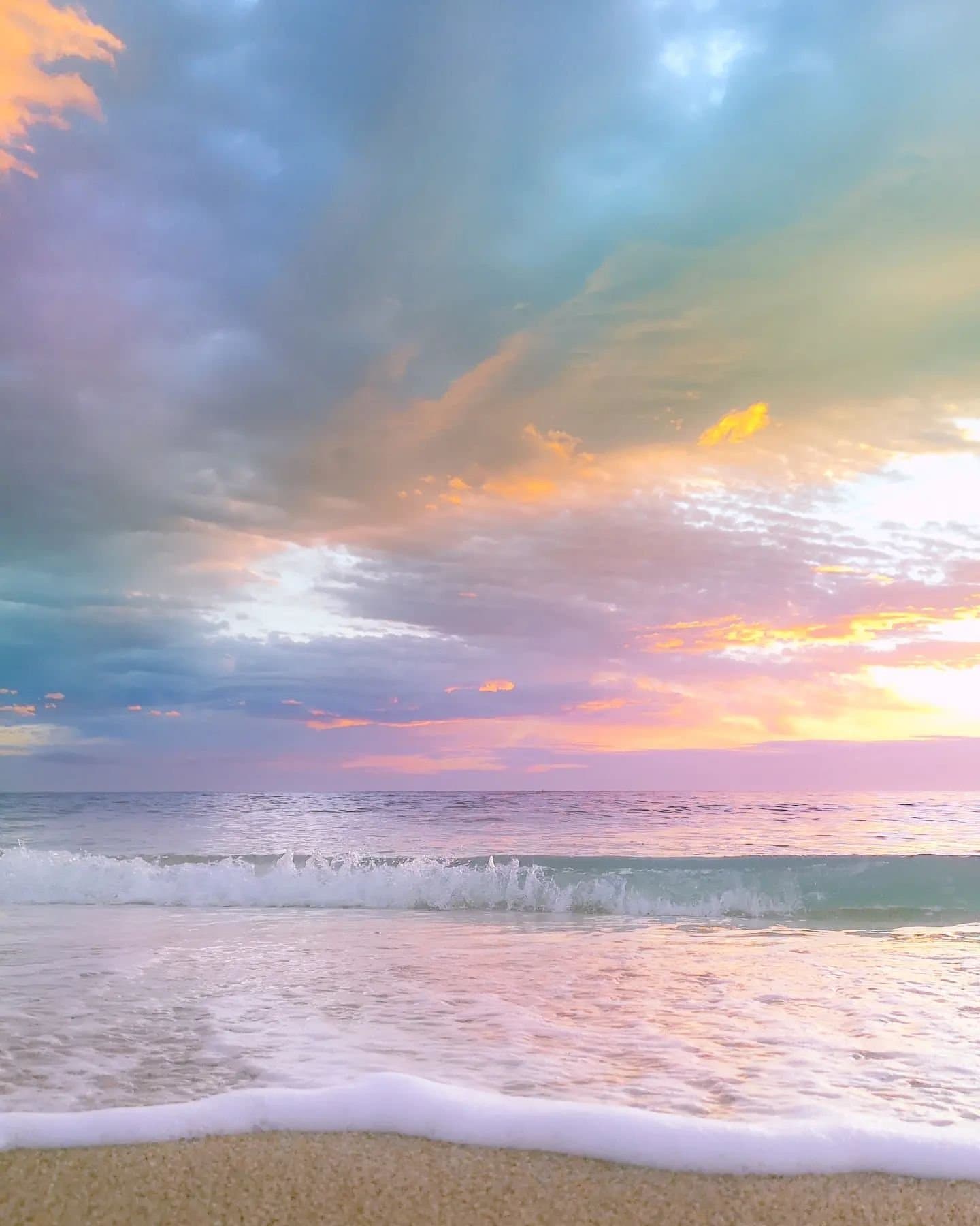 a photorealistic image of a serene beach at sunset with past