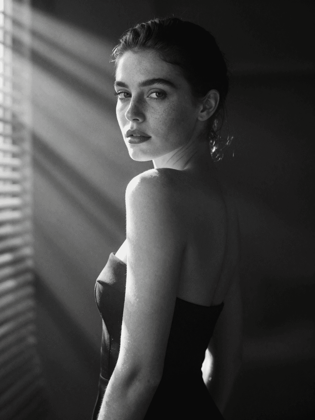 A hyperrealistic 8k black and white cinematic mid shot portr