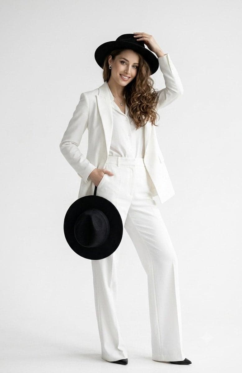 A full-length studio portrait of a confident, smiling woman